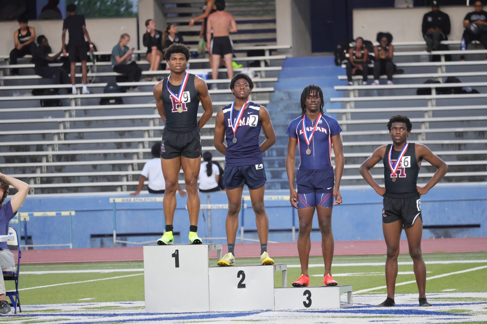 Christian C. Ferguson on the podium with a medal after a Houston Heights track meet