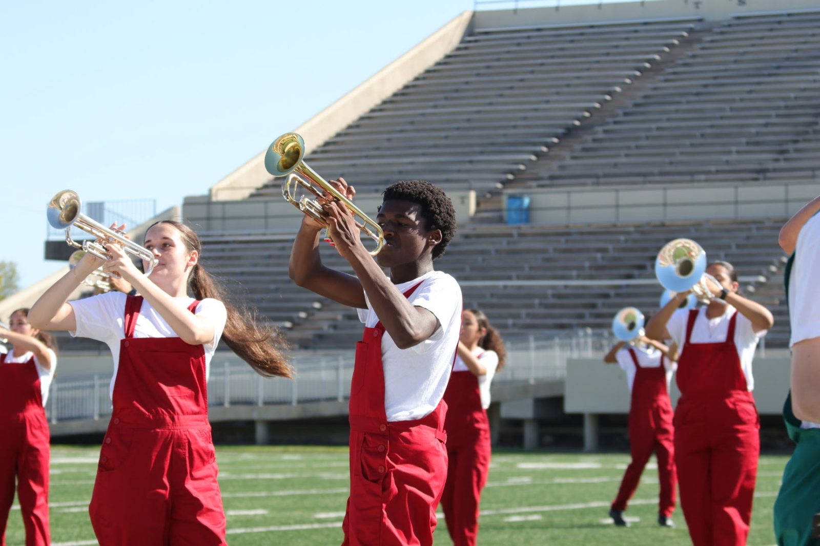 Houston Heights High School marching band performing on the field